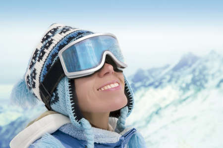 Portrait of young woman against a background of the mountains  の写真素材
