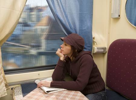 Young woman travel in passenger roomette  の写真素材