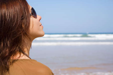 Portrait of young girl on the beach  の写真素材