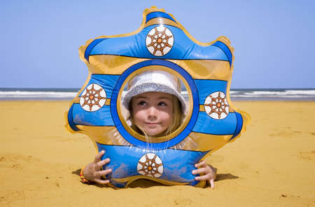 Portrait of little girl on the beach  の写真素材