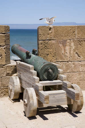 Old fashioned sea cannon aimed to the sea  の写真素材