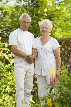 Mature loving couple in the garden  の写真素材