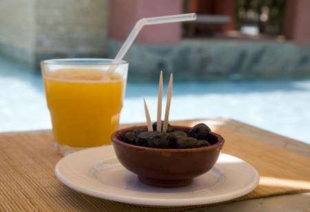 Still life with olives and orange juice  の写真素材