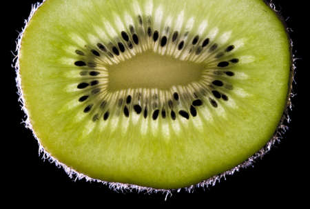 Close-up view of kiwi fruit over black  2の写真素材