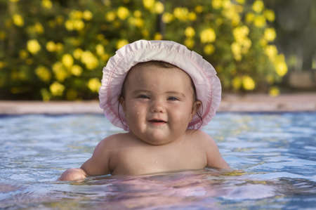 Little baby swim in a poolの写真素材