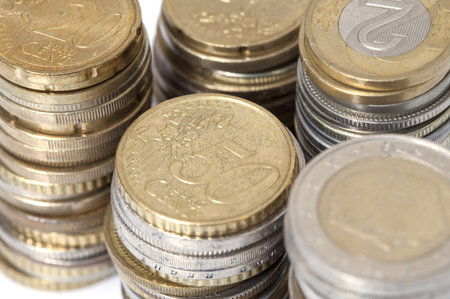Piles of coins isolated on the white background