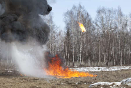 Explosion in action in a field at dayの写真素材