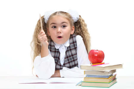 Pretty schoolgirl having thought of a great ideaの写真素材