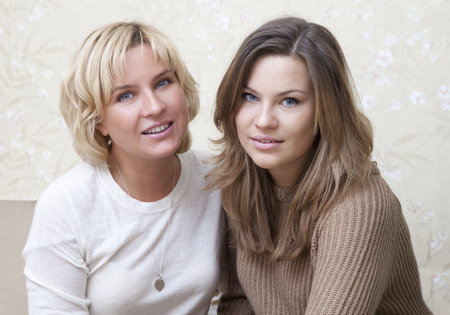 Portrait of caucasian woman with her daughter posing 
