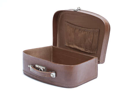 old and used suitcase is open in the white backgroundの写真素材