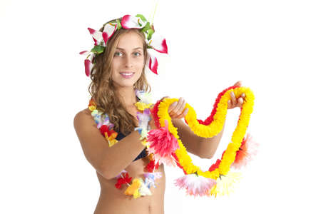 Attractive girl offers a smile and a lei to her guestの写真素材