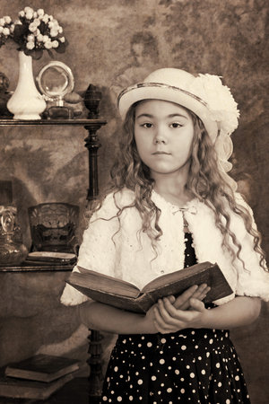 Little girl portrait. Intentional 1900's style post processing emulation.の写真素材