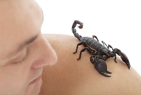 Young Caucasian man with scorpion on his shoulderの写真素材