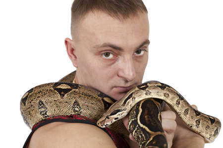Portrait of Young Caucasian man with boa snake. Closeupの写真素材