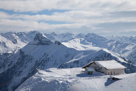 Lonely house in the Alps in winter landscape of the Dolomites