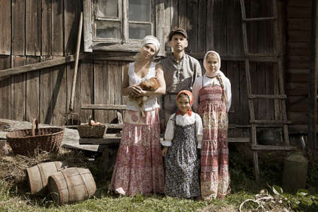 Vintage styled family portrait depicting mother, father and two daughters の写真素材