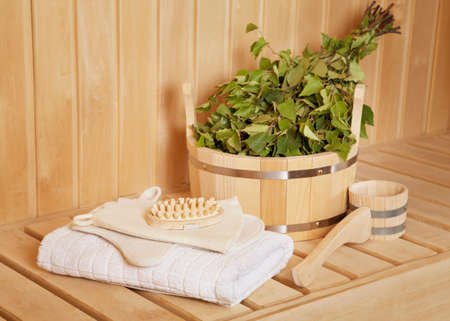 Sauna stuff - birch besom and a bucket with accessories
の写真素材