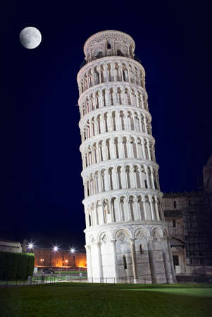 Leaning Tower of Pisa in the night with a big moon in the sky, Italyの写真素材