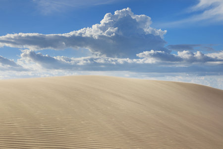 Mui Ne white sand dunes on the background of blue sky. Southeast Asia, Vietnam