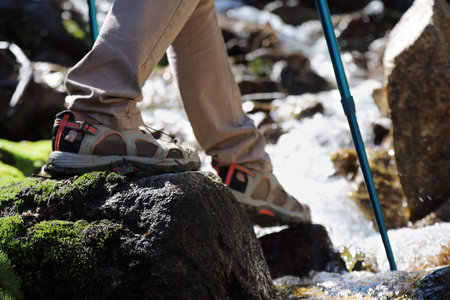 Young woman with sneakers walking nature. Healthy lifestyle concept