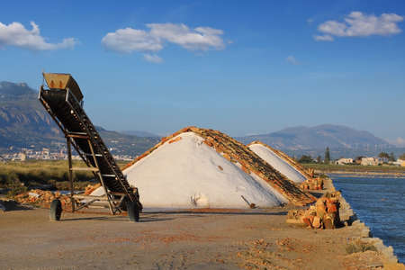 Production of sea salt on salt marshes near the town of Trapani. Sicily, Italyの写真素材