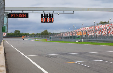 Finishing line with the finish on the electronic display and the lights on the race trackの写真素材