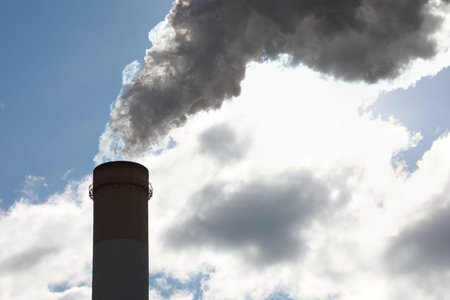 Air pollution. Industrial pipe with thick smoke pollute the atmosphere