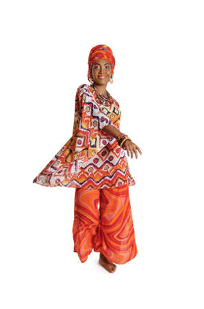 Beauty African American woman in traditional clothes dancing in the studio, isolated on a white backgroundの写真素材