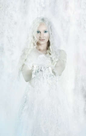 Conceptual art portrait of a water girl with blue eyes on a water backgroundの写真素材