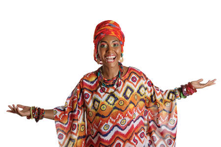 Young and attractive African American black woman in the national African dress isolated on a white background. Cosmetics, ethnicity.の写真素材