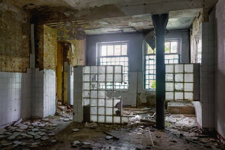 Destroyed interior of the former kitchen dining room of an old abandoned houseの写真素材