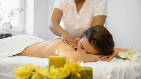 Relaxing young adult woman at the beauty parlor. Young Asian woman doing Vietnamese massageの写真素材