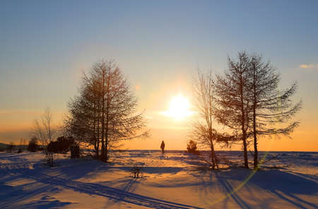 Beautiful sunset on a clear frosty evening on Lake Baikal, Russiaの写真素材