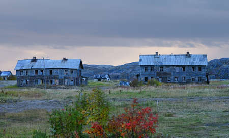 Abandoned wooden houses in the village of Teriberka in the harsh northern territory of Russiaの写真素材