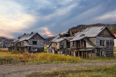 Abandoned wooden houses in Teriberka village in the harsh northern territory of Russiaの写真素材