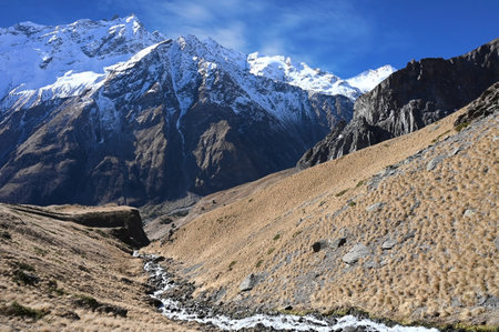 Landscape with snow-capped Caucasus mountains and mountain frozen river, Russiaの写真素材