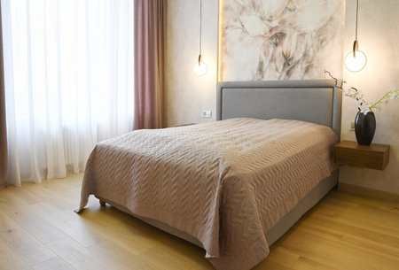 The interior of the bedroom with  lighted lampsの写真素材