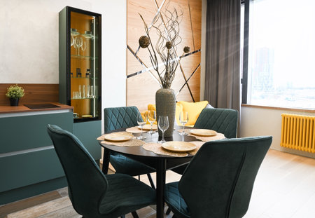 Interior of a dining room with large window in a modern residential apartmentの写真素材