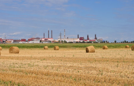 Haystacks with a view of the plant for the production and processing of potash saltの写真素材