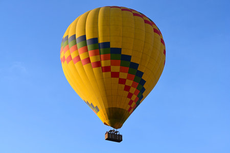 Hot air balloon is flying in the blue African sky. Kenyaの写真素材