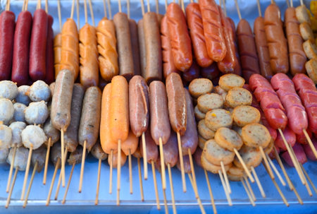 Close-up of fried various meat and sausages on sticks. Typical Thai street foodÂ の写真素材