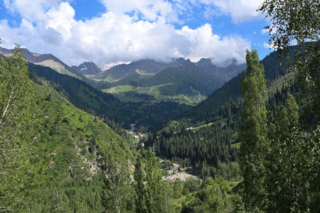 Beautiful landscape of the valley in the Tien Shan mountains overlooking the resort of Chimbulak, Kazakhstanの写真素材