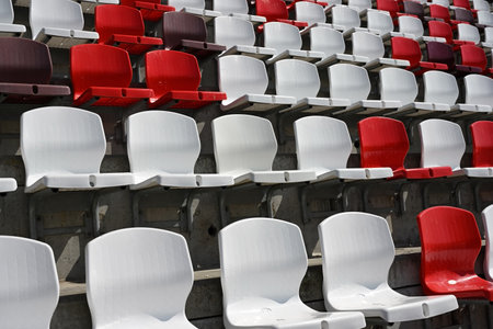 Colorful empty plastic seats on new modern sports stadiumの写真素材