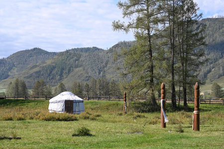 A traditional dwelling of the nomadic peoples of Asia, a yurt stands in the middle of the steppeの写真素材