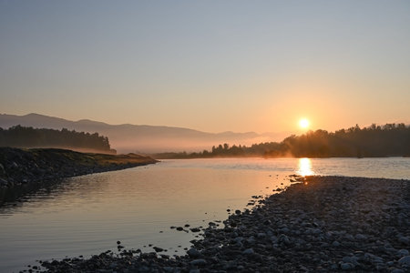 The landscape of the morning sun rising over the river