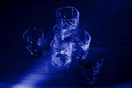 glasses in blue lightの写真素材