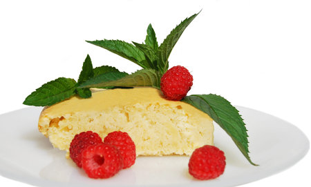 Homemade cupcake with fresh mint leaves and raspberry berries