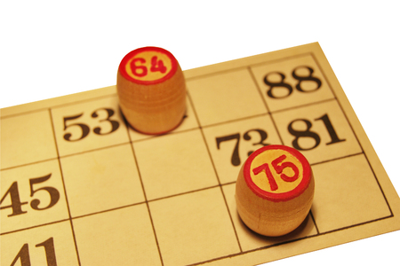 Ancient Russian lotto game, a card with numbers and wooden barrels, isolate on a white background.の写真素材