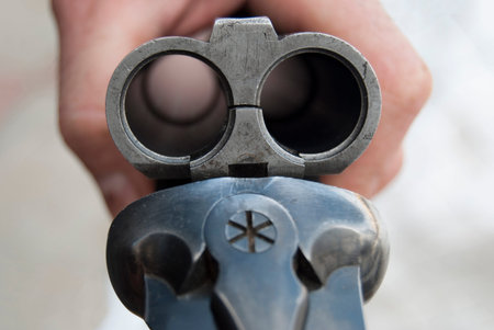 Open hunting rifle. Empty barrel without cartridges close-up.