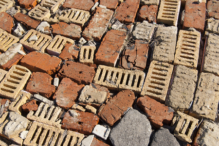 Homemade road from chaotically spread out bricks of different colors. Texture close-upの写真素材